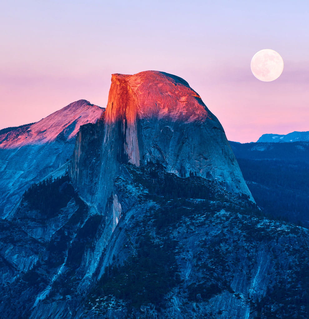 iStock-928738926 moon setting behind mountain