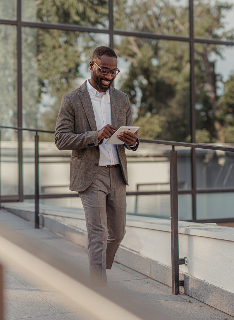 corporate_16-2 smiling businessman on tablet