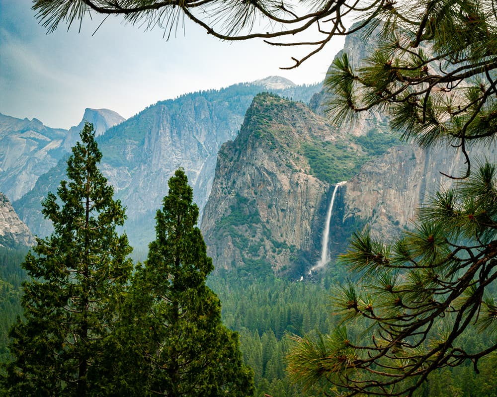 Yosemite National Park iconic scenery view of mountains with waterfall